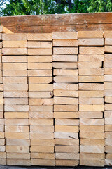 End view of a stack of lumber, materials for building a new house
