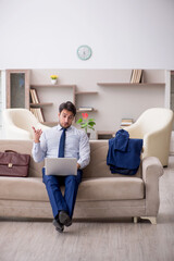 Young male employee working from home during pandemic