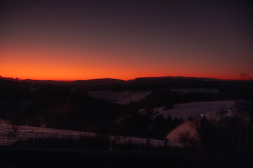 Sunset in snowy mountains