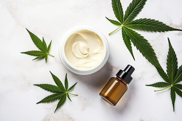 Obraz na płótnie Canvas CBD oil THC tincture and hemp leaves on marble background Minimalistic cosmetic Hemp oil cream with marijuana leaves