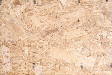 Closeup of a section of new Oriented Strand Board (OSB) engineered wood used in home construction
