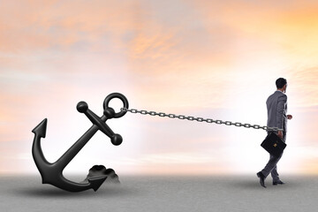 Businessman with anchor in business concept