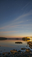 Spectacular view of the lake and the stars above it, vertically