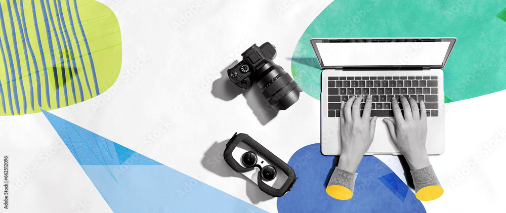 Poster laptop computer with a slr camera and vr from above