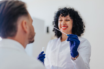 In a medical setting, a doctor checks blood pressure, blood sugar, and conducts a hearing exam using specialized tools. Patient receives expert care and support.