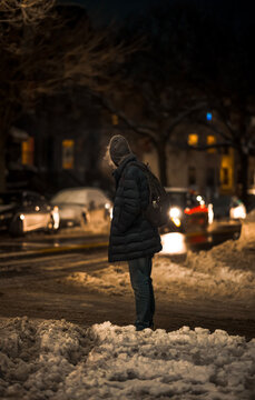 Man walking in the city on a snow day 