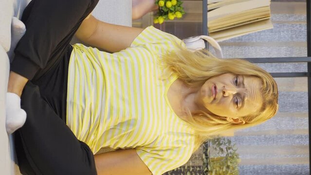 Vertical video of Sick woman with rapid breathing. The woman cannot control her breathing.