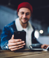 Happy man surfing internet in modern digital gadget