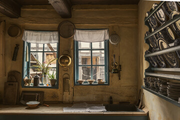 Interior view of old dirty and dark kitchen of traditional danish wooden houses.