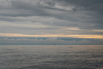 View of the Black Sea on the coast of Sochi against the sunset sky, Sochi, Krasnodar Krai, Russia