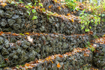 Retaining wall gabion baskets, Gabion wall caged stones textured background