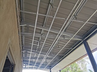 Aluminum ceiling structure inside of a house at construction site.