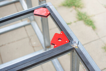 worker  welds the steel structure at the construction site.