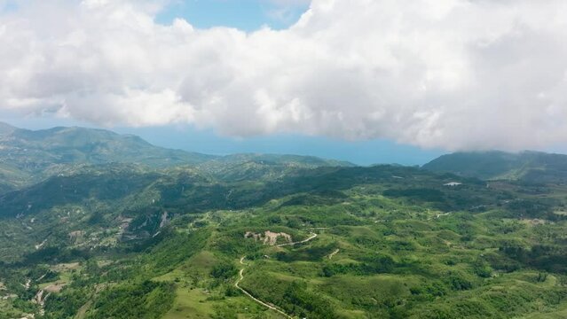 Aerial view of countryside with agricultural land in the mountains. Libo hills. Cebu island, Philippines.