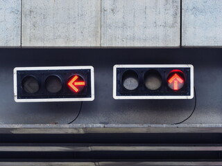 Red light for straight and red arrows for turning left (all cars must stop). Red traffic lights are...