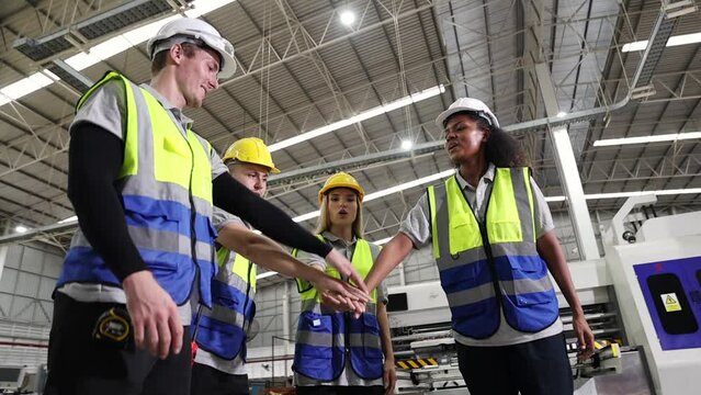 Group workers 
diverse multiethnic working together join hands stacked for unity in the organization. and teamwork : Join forces to build a team of people in the concept of successful teamwork.