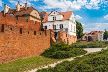 Old Town Warsaw. Towers and red brick walls of the historical Warsaw Barbican fort, Poland