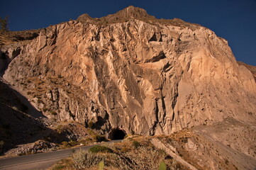 Tunnel in the rock in Colca canyon, Peru