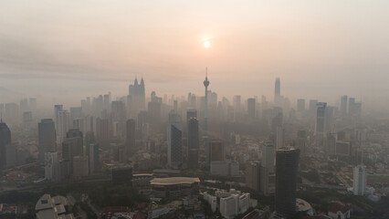 Aerial view of beautiful kuala lumpur cityscape skyline in the hazy or foggy morning enviroment and...
