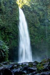 Long-exposure shot of waterfall and river in jungle - Bali, Indonesia