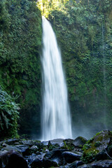 Fototapeta premium Long-exposure shot of waterfall and river in jungle - Bali, Indonesia