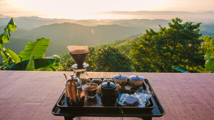 drip coffee in the morning with a look at the mountains of Doi Chang Chiang Rai Thailand - obrazy, fototapety, plakaty