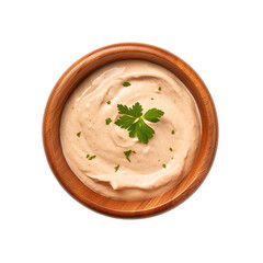 Top view of chipotle mayo dip in a wooden bowl isolated on a white background