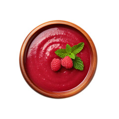 Top view of raspberry coulis dip in a wooden bowl isolated on a white background