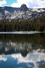 Fototapeta na wymiar a vertical shot of the mammoth lakes with rocky mountains and forest on the background, CA
