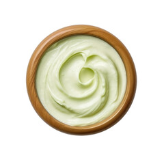 Top view of wasabi mayo dip in a wooden bowl isolated on a white background