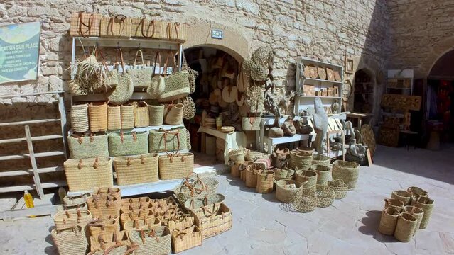 Explore the vibrant markets of Essaouira, where you can find a tapestry of colorful goods, alongside the city's distinctive architecture, steeped in a history that stretches back centuries.