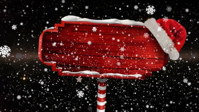 Animation of christmas red sign with copy space, snow and stars falling on black background