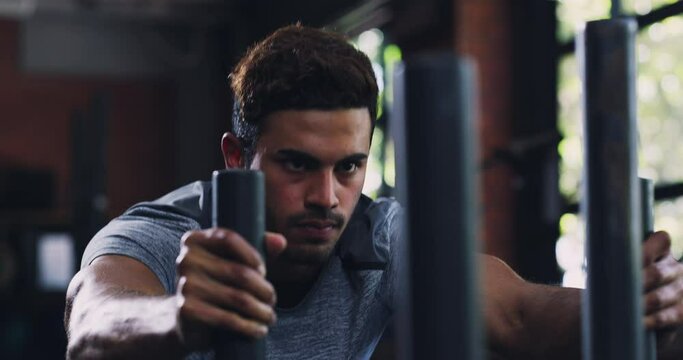 Gym, power and serious man push sled for workout, fitness or endurance challenge, resilience or active performance. Determined, hard work and strong person training, discipline or body building