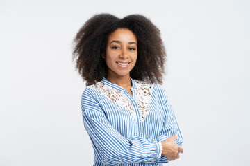 Portrait of successful smiling african american businesswoman with curly hair with crossed arms