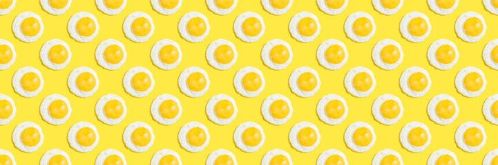 Seamless pattern with sunny side up egg on yellow background. Food banner.