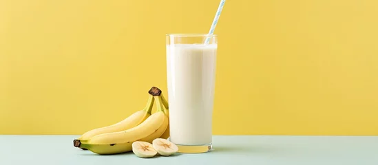 Foto op Canvas Healthy bones can be maintained with a banana and milk shake With copyspace for text © 2rogan