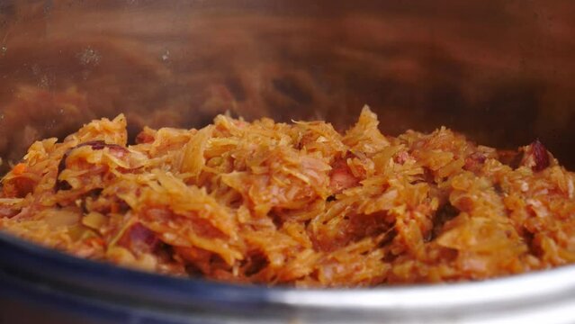 Scooping Hot Freshly Cooked Bigos With Spoon. Hunter's Stew. closeup