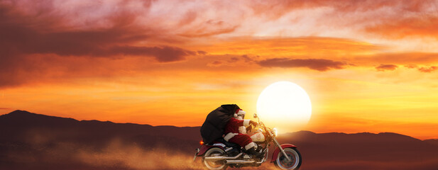 Adventurous Santa riding a motorbike at sunset