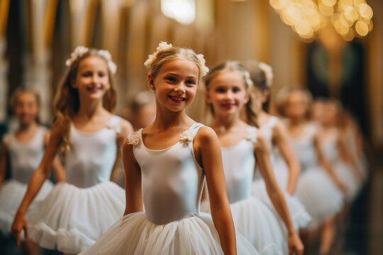 Fototapeta A classroom of aspiring young ballerinas gracefully dancing in unison 