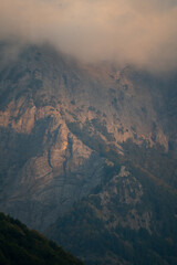 Sunset in the Albanian Alps near Theth. Red illuminated mountains.