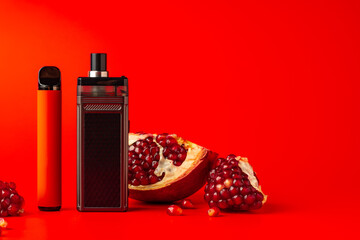 Electronic cigarette with pomegranate flavor on red background