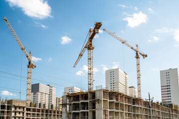 Construction industry building. Construction industry site with cranes, fittings and concrete.
