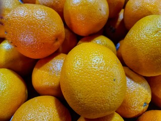 A Pile Of Several Yellowish Lemons On The Table