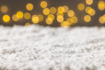 Fototapeta na wymiar Christmas fairy lights and copy space on snow background