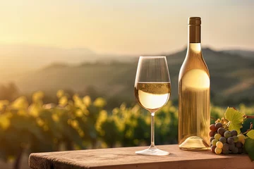 Fotobehang Mock-up white wine bottle without label, glass, promotion, advertising, vineyards at sunset © Beastly