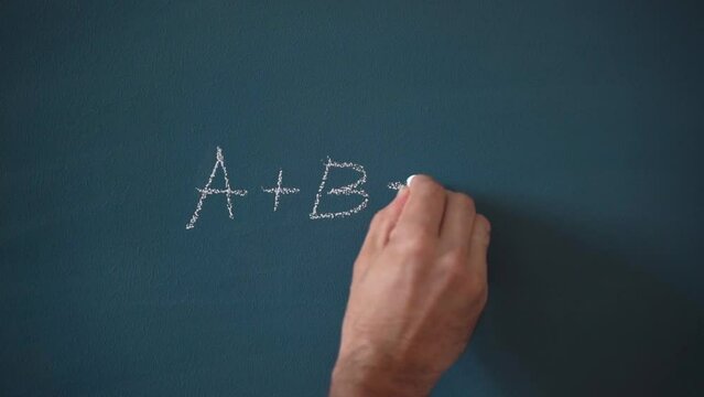 School teaching of mathematics and sciences. Mathematical formula on a blackboard in a school classroom.