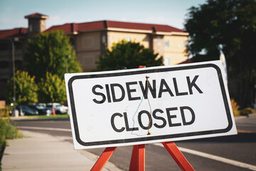 Sidewalk closed sign at construction site