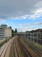 Fototapeta na wymiar Gdansk, Poland - 08.08.2022: View of the railway tracks from the pedestrian bridge.