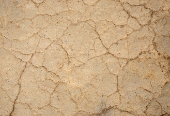 A close-up with an old clay wall