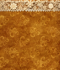 Horizontal or vertical Background with lace borders on grunge old soiled paper texture. Vintage backdrop with paper texture of brown color and lace tape with floral ornament
